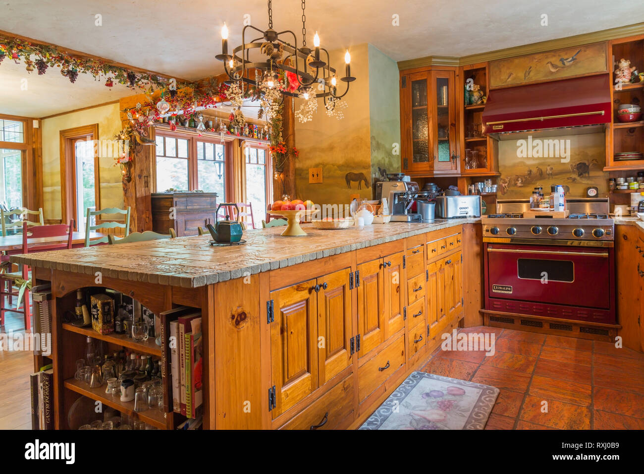 Stone and inlaid ceramic tile top pinewood island and