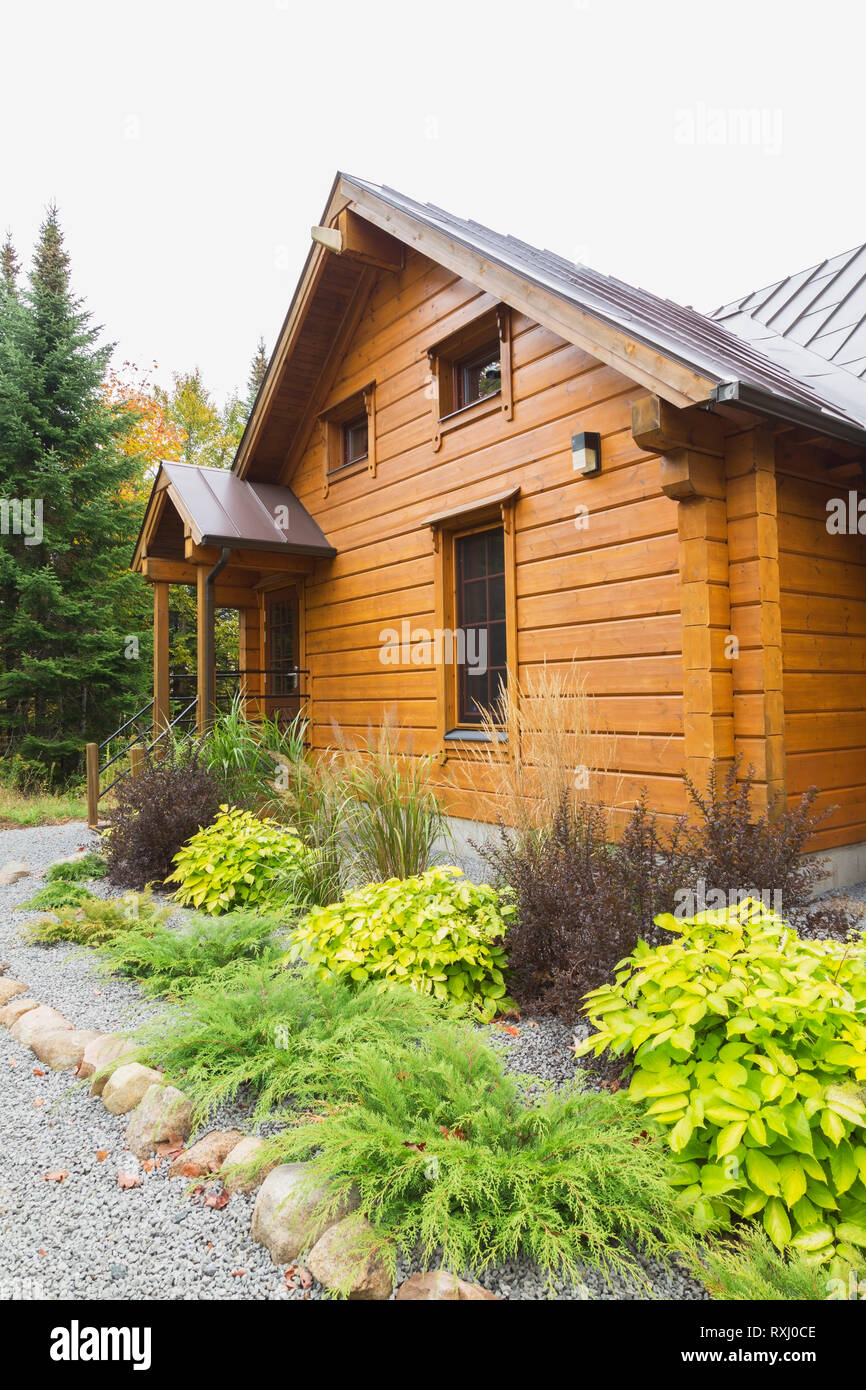 Piece Sur Piece Scots Pine Log Home Facade With Brown Standing