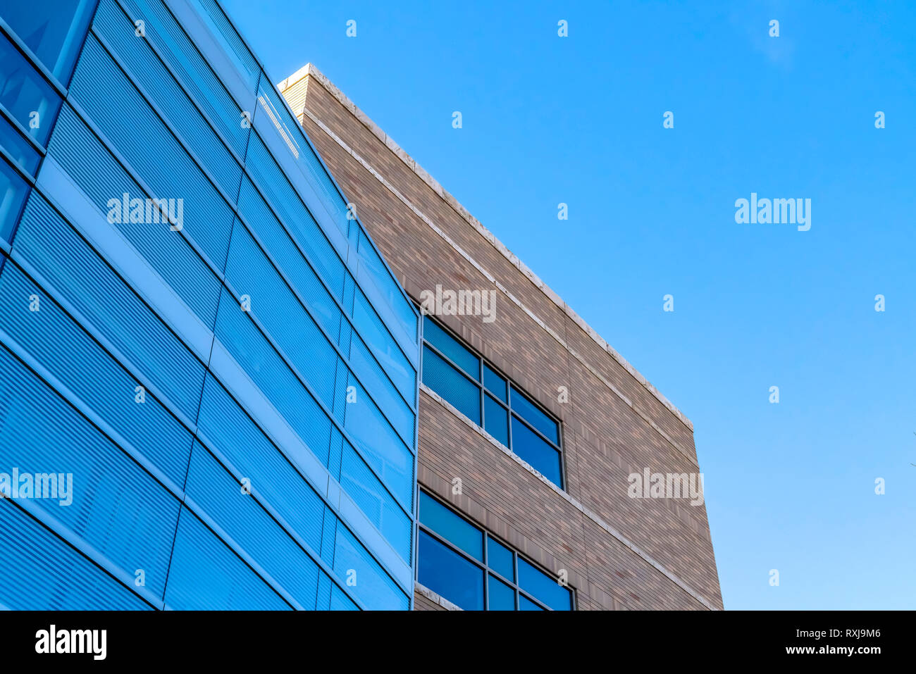 A Modern building against vibrant blue sky Stock Photo - Alamy