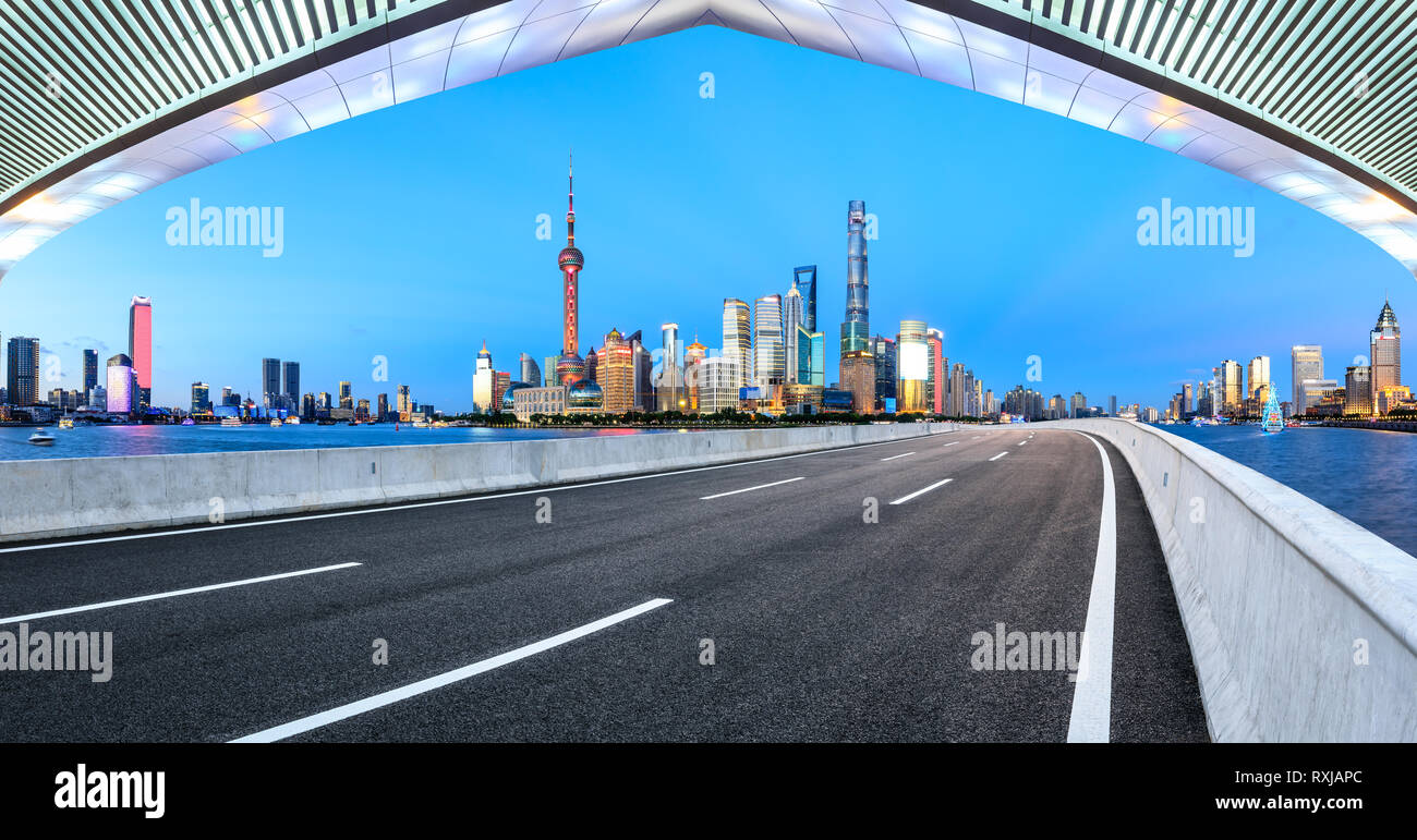 Empty asphalt road through Shanghai - Empty Asphalt Road Through Shanghai Business District RXJAPC 