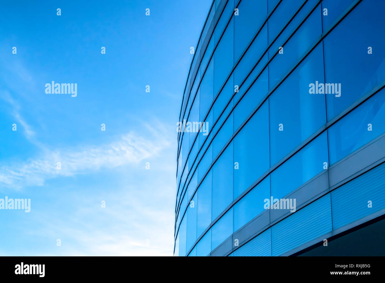 Building exterior with bright blue sky background Stock Photo