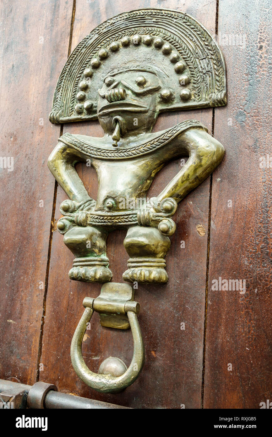 Cartagena Colombia,metal door knocker,fancy ornate doorknocker,aldaba,Pre-columbian figure,COL190119191 Stock Photo