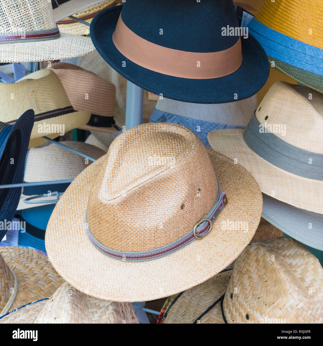 Vintage straw hats stacked in front of shop Stock Photo Alamy