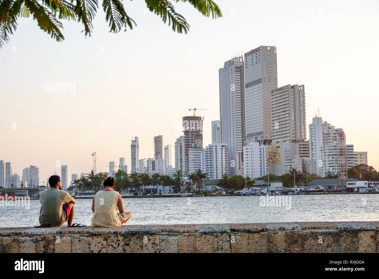 Cartagena Colombia,Center,centre,Getsemani,view of Bocagrande,city skyline,skyscrapers,Laguna de San Lazaro,waterfront park,man men male,woman female Stock Photo