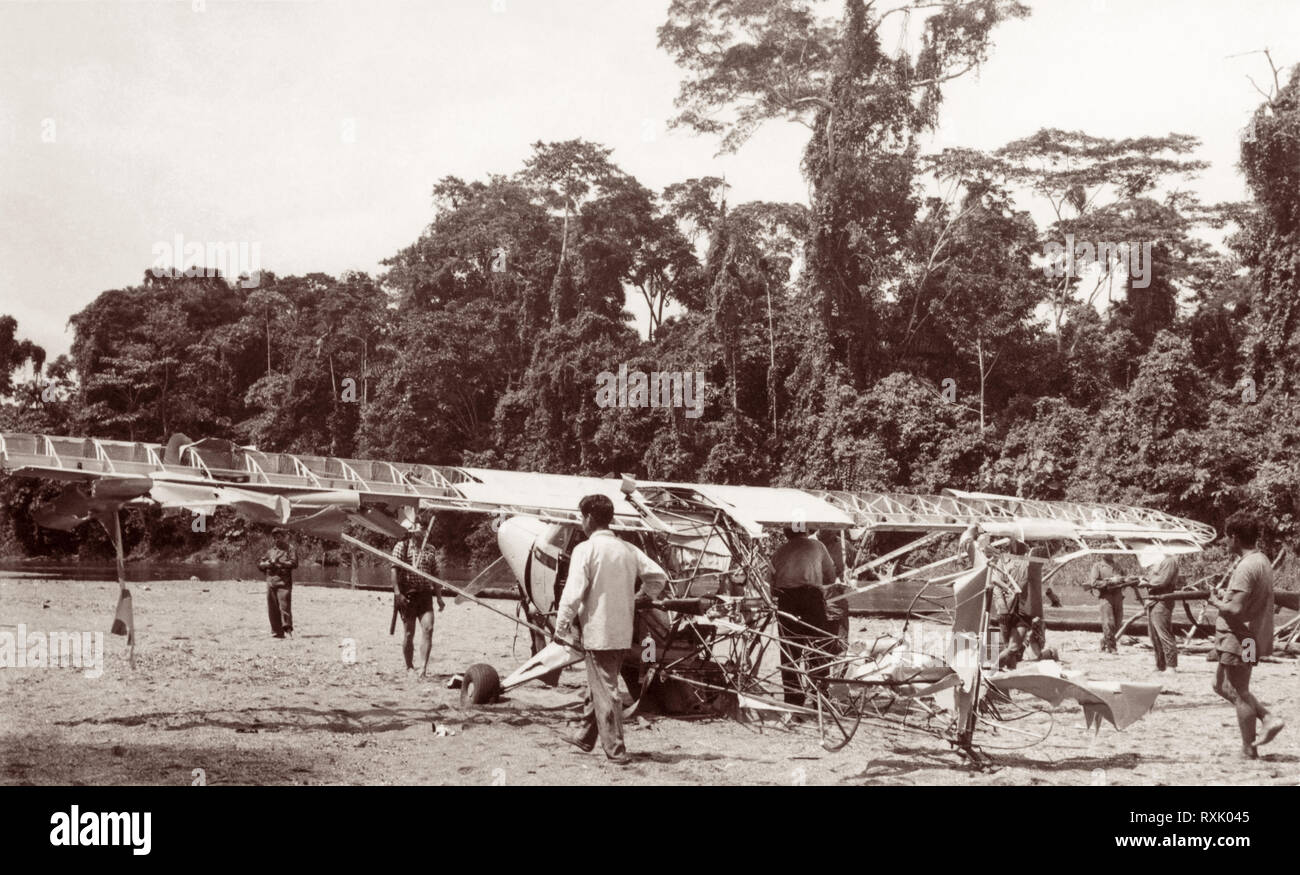 Rescue party at the site where five evangelical Christian missionaries were murdered by Auca (Waodani/Huarani) Indians on January 11, 1956 in the Amazon Basin jungle of Ecuador. The martyred missionaries included Jim Elliot, Nate Saint, Peter Fleming, Ed McCully, and Roger Youderian. The story, covered by LIFE magazine in January 1956, is also told in the 1957 best-selling book Through Gates of Splendor by Elisabeth Elliot (Jim Elliot's wife), and the 2005 film End of the Spear which tells the story from the perspective of Steve Saint (Nate Saint's son). Stock Photo