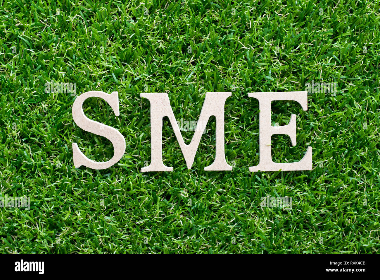 Wood alphabet in word SME (abbreviation of Small and medium sized