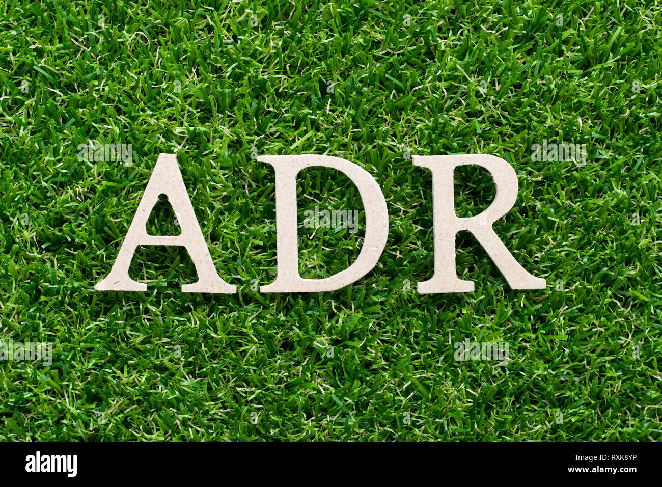 Wood Alphabet In Word ADR Abbreviation Of Adverse Drug Reaction On Artificial Green Grass 