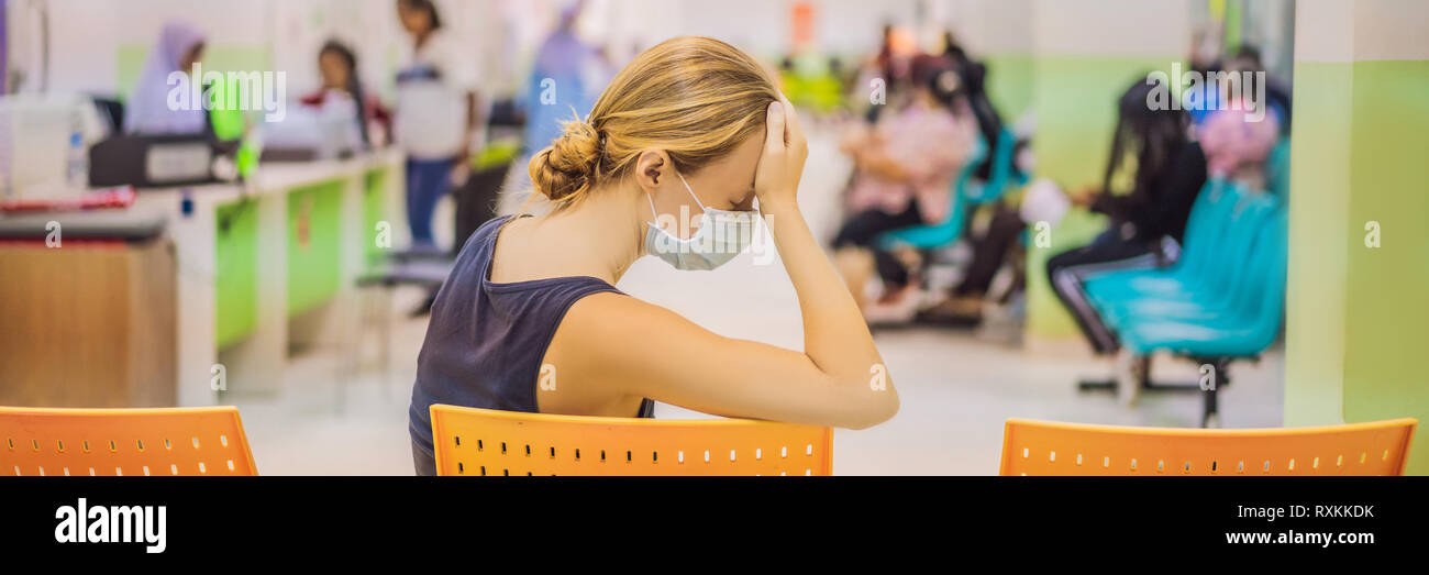 Young Woman Sitting In Hospital Waiting For A Doctor S Appointment