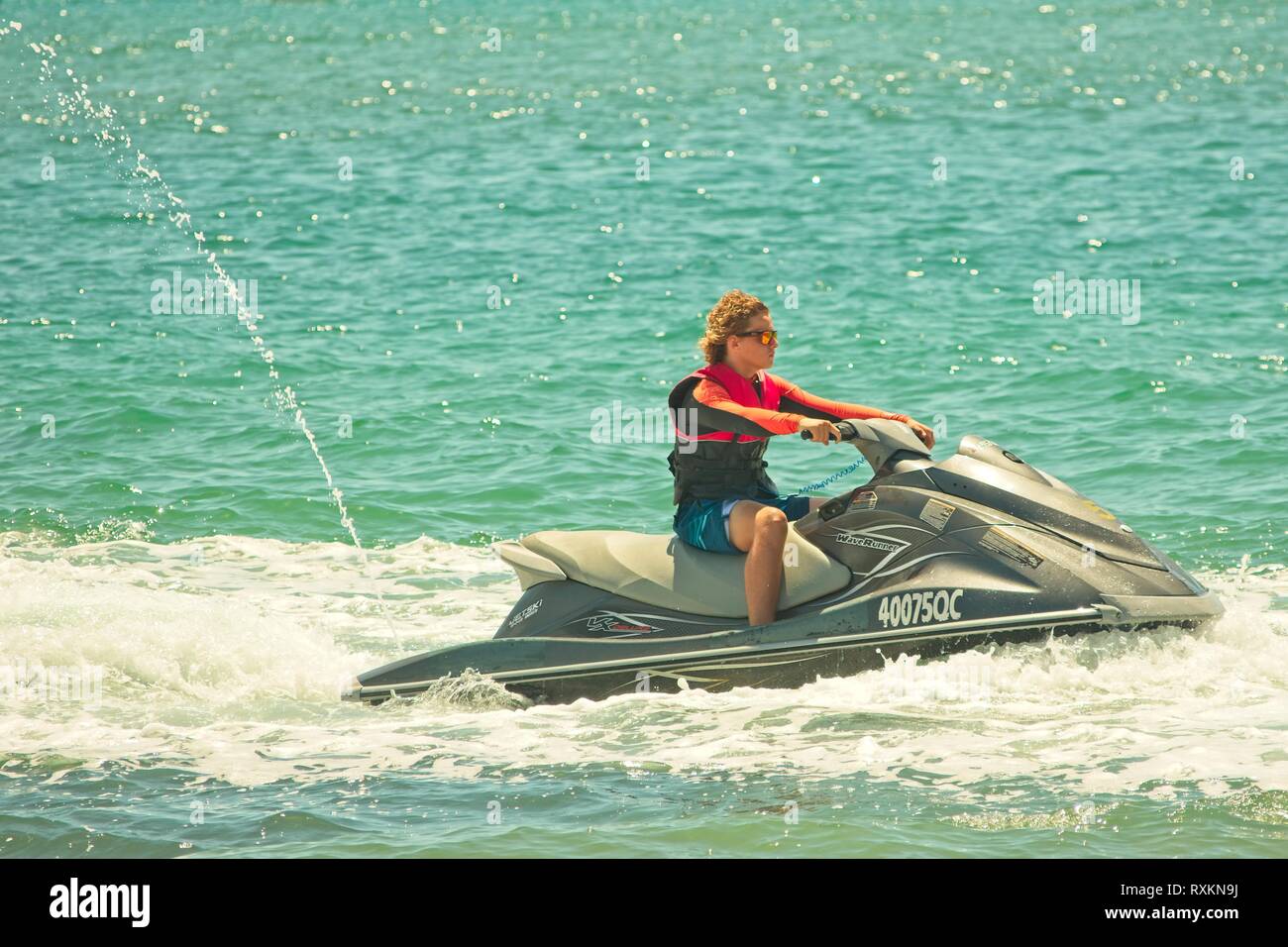 Teen on jet ski hires stock photography and images Alamy