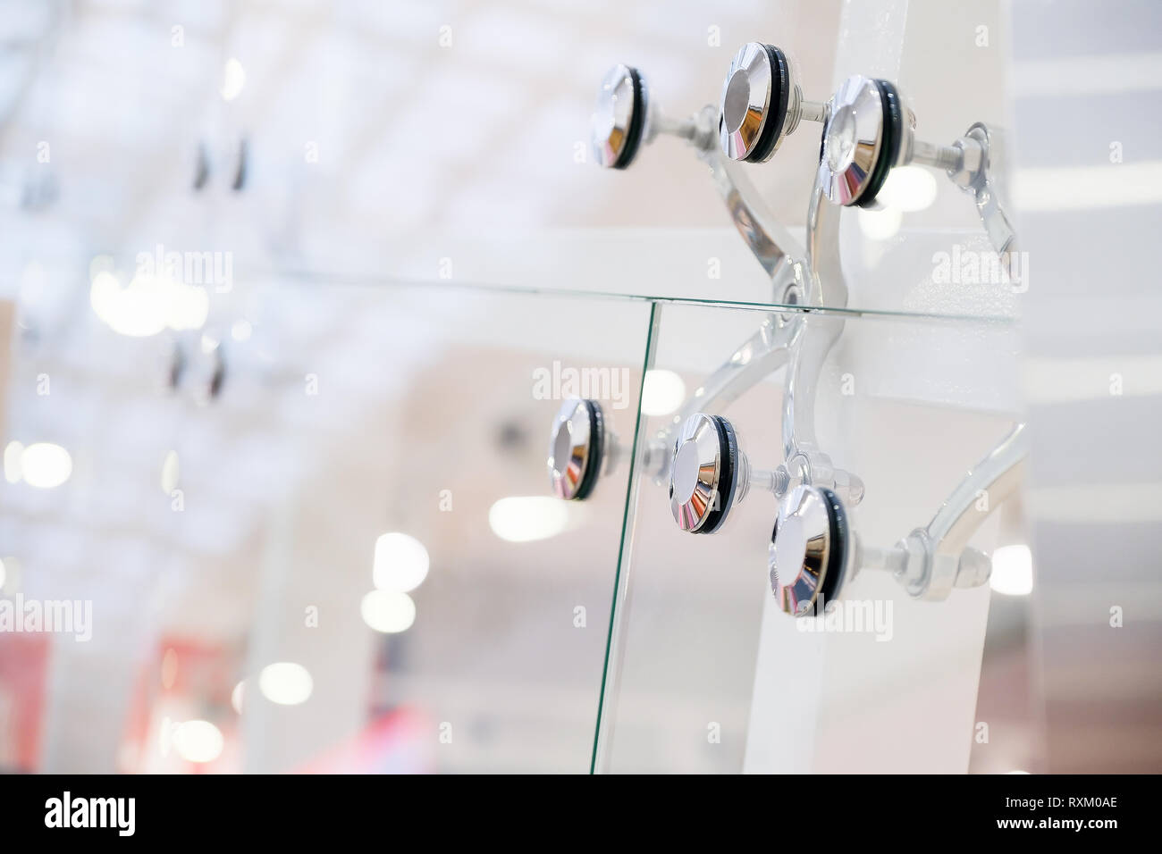 Glass facades and walls. Metal fasteners. Selective focus Stock Photo