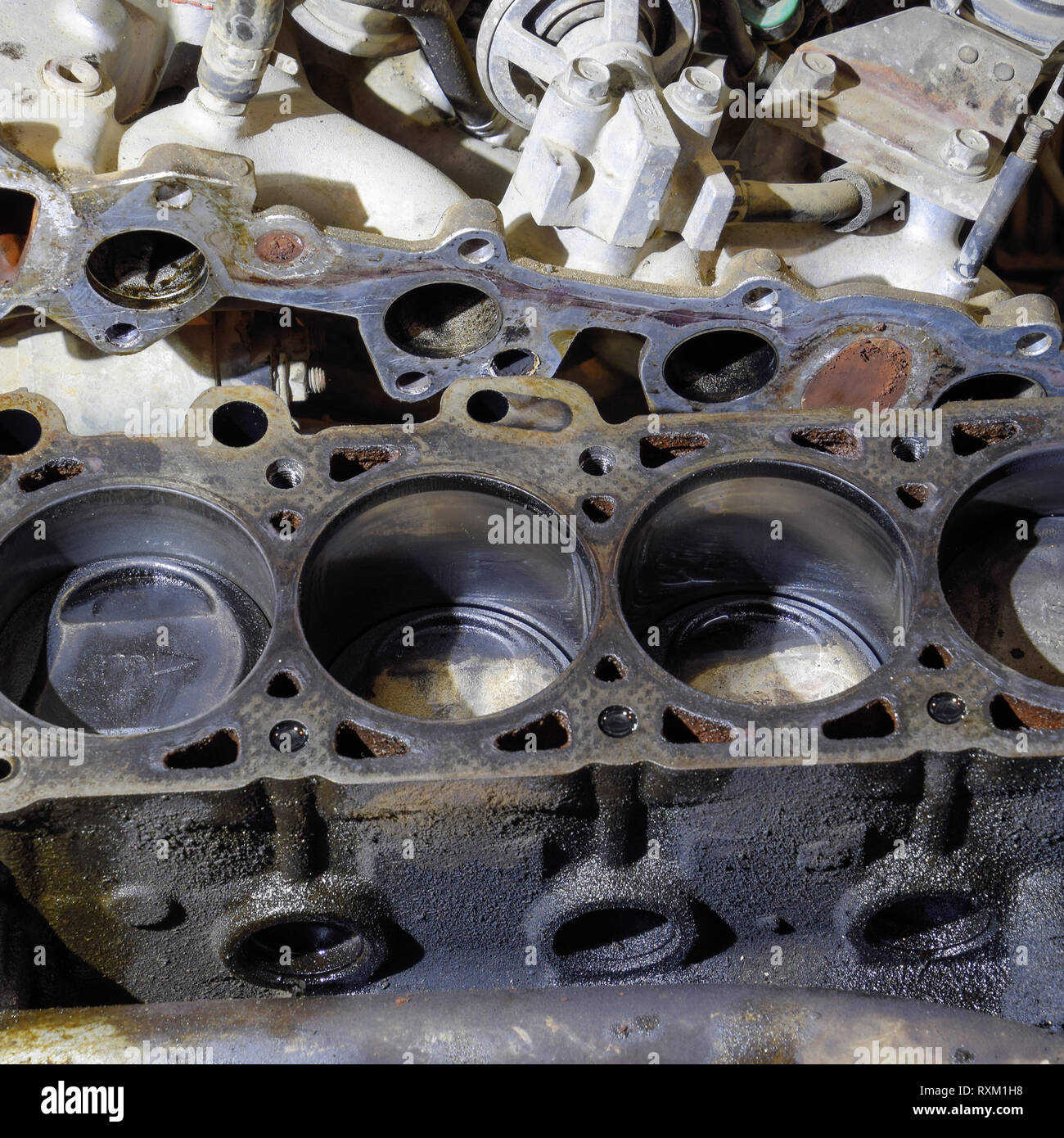 The cylinder block of the fourcylinder engine. Disassembled motor