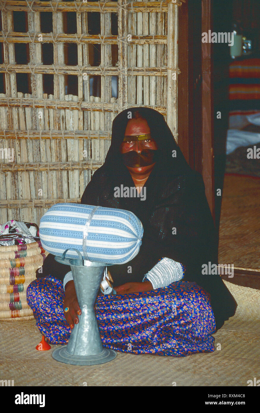 Arab Folklore And History With An Emirati Bedouin Women Demonstrating The Art Of Weaving Silver Thread Braid During The Dubai Trade Festival In The United Arab Emirates Stock Photo Alamy