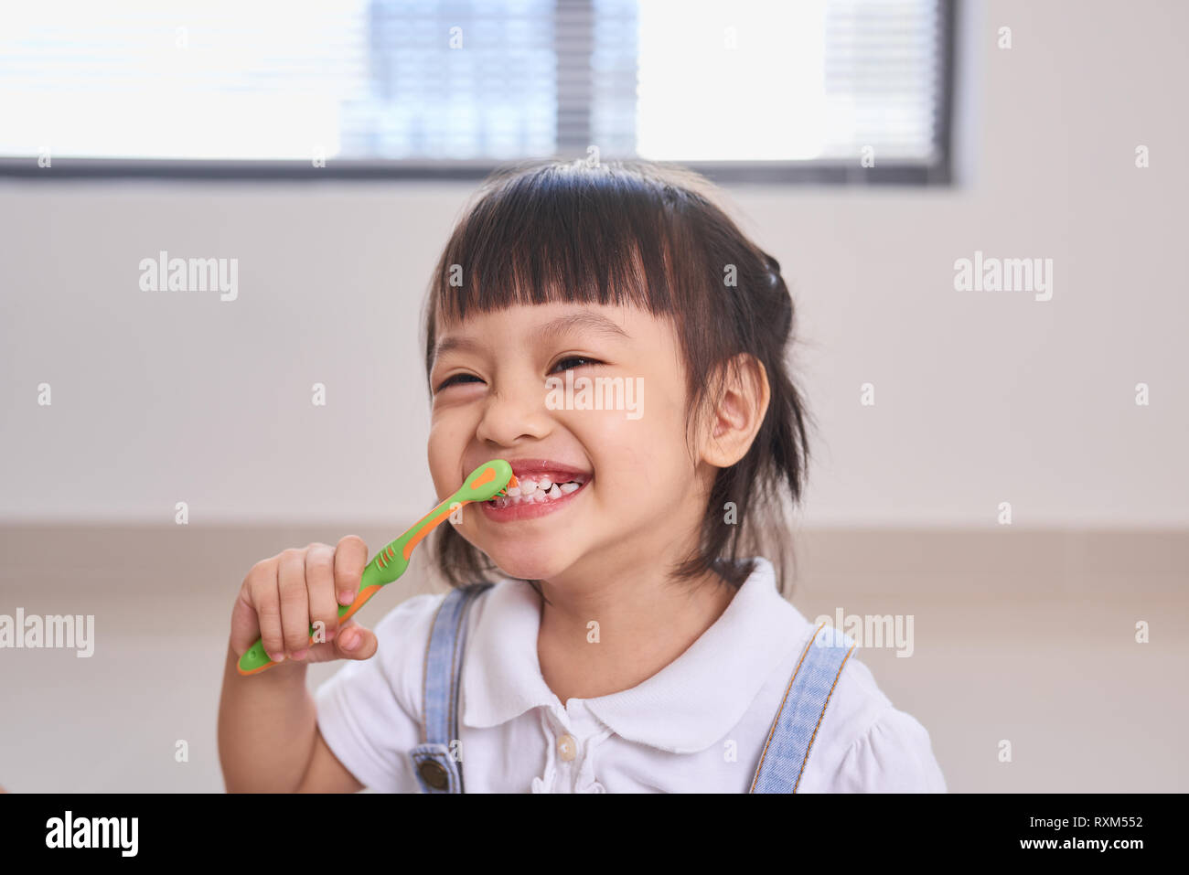 dental hygiene. happy little girl brushing her teeth Stock Photo Alamy