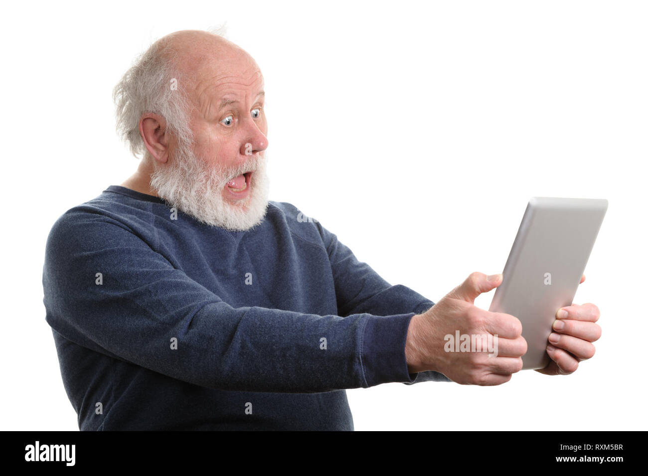 Funny shocked senior man using tablet computer isolated on white Stock Photo
