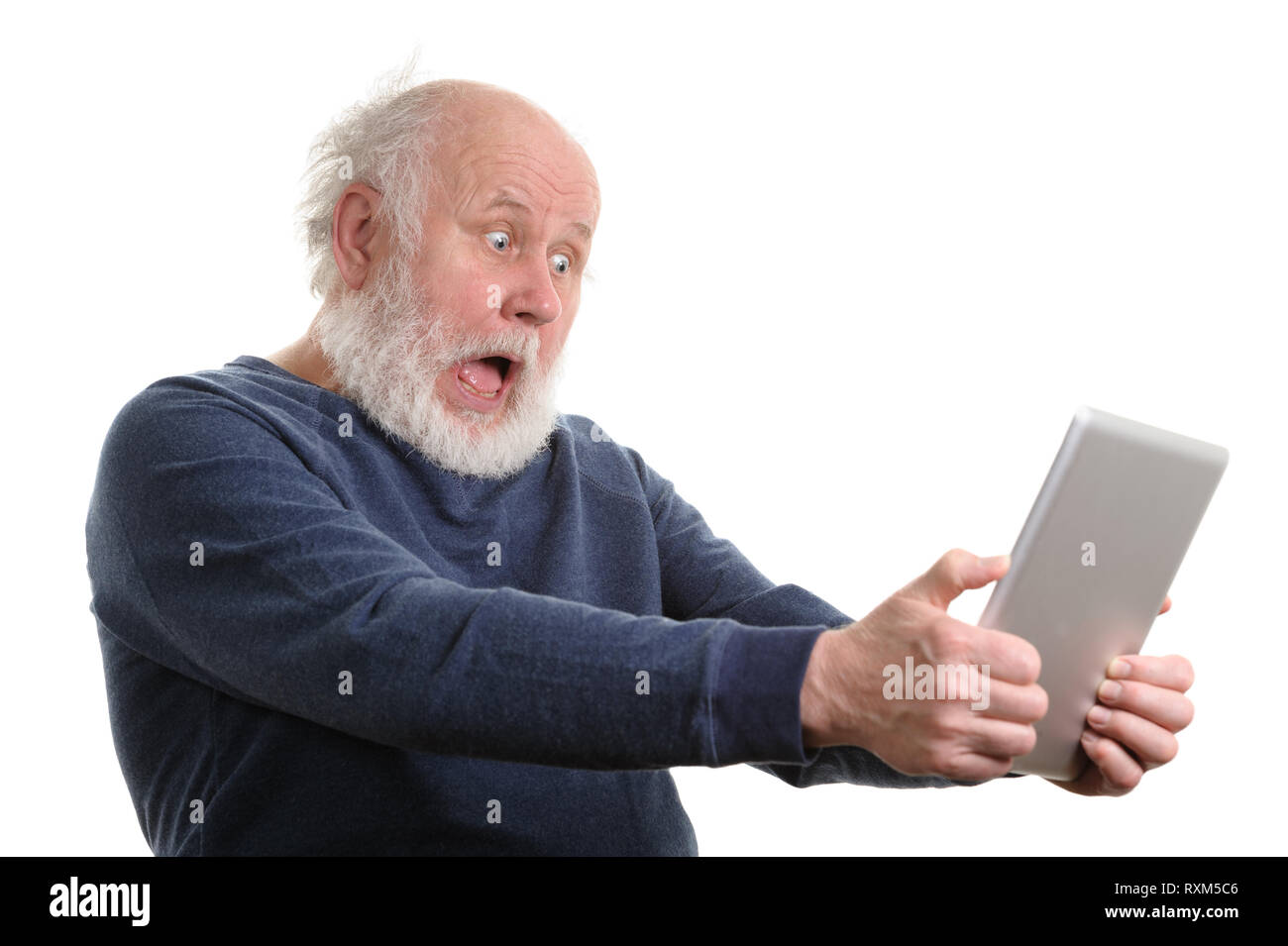 Funny shocked senior man using tablet computer isolated on white Stock Photo