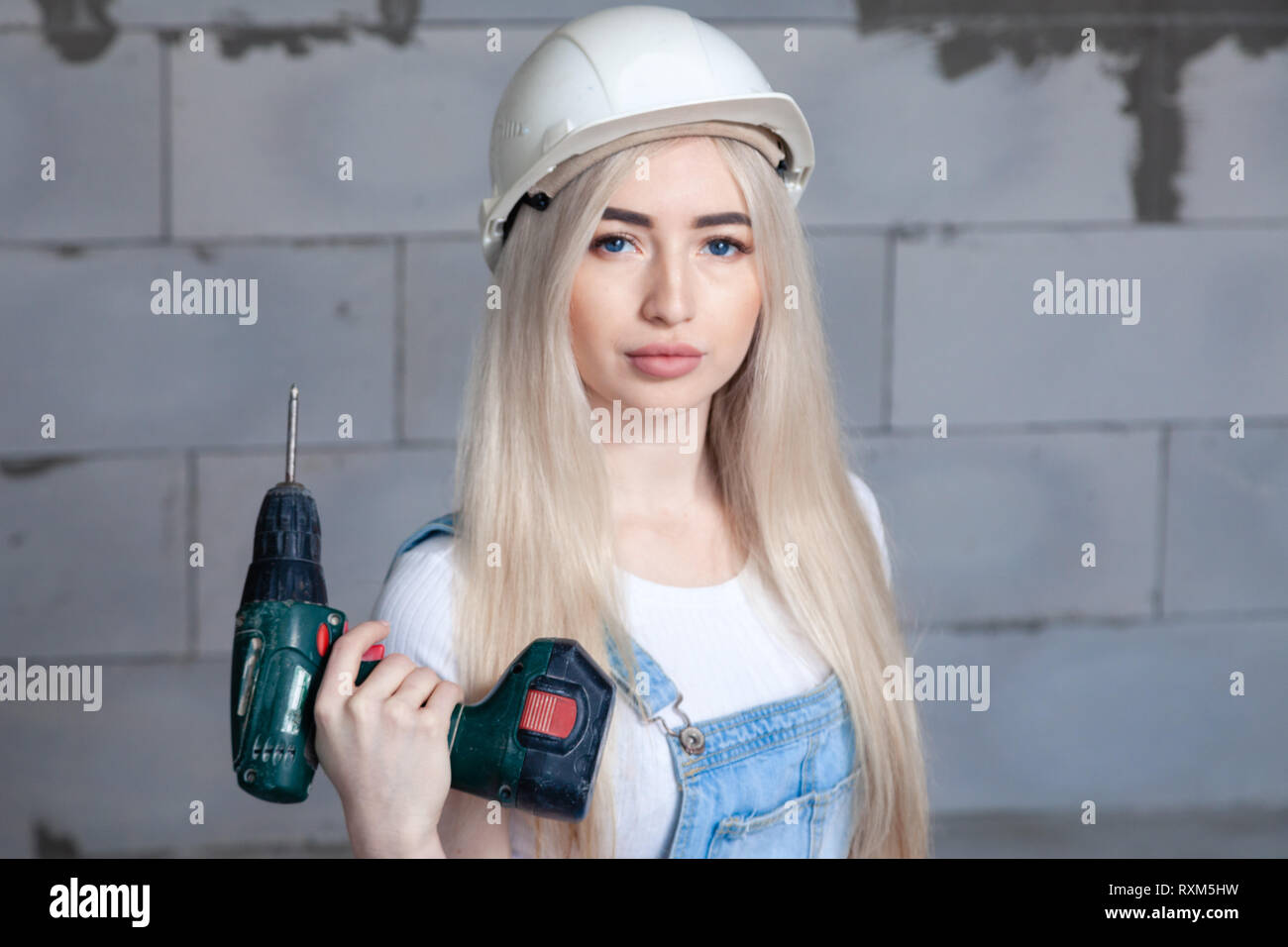 Cute girl designer foreman blonde in 