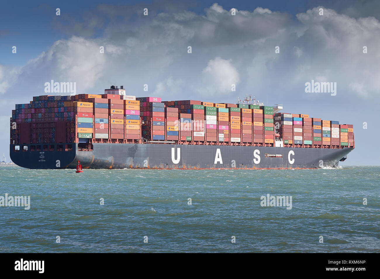 The Fully Loaded Ultra-Large Container Ship, SAJIR, (Renamed BRUSSELS EXPRESS), Departs The Port Of Southampton, Hampshire, United Kingdom. Stock Photo