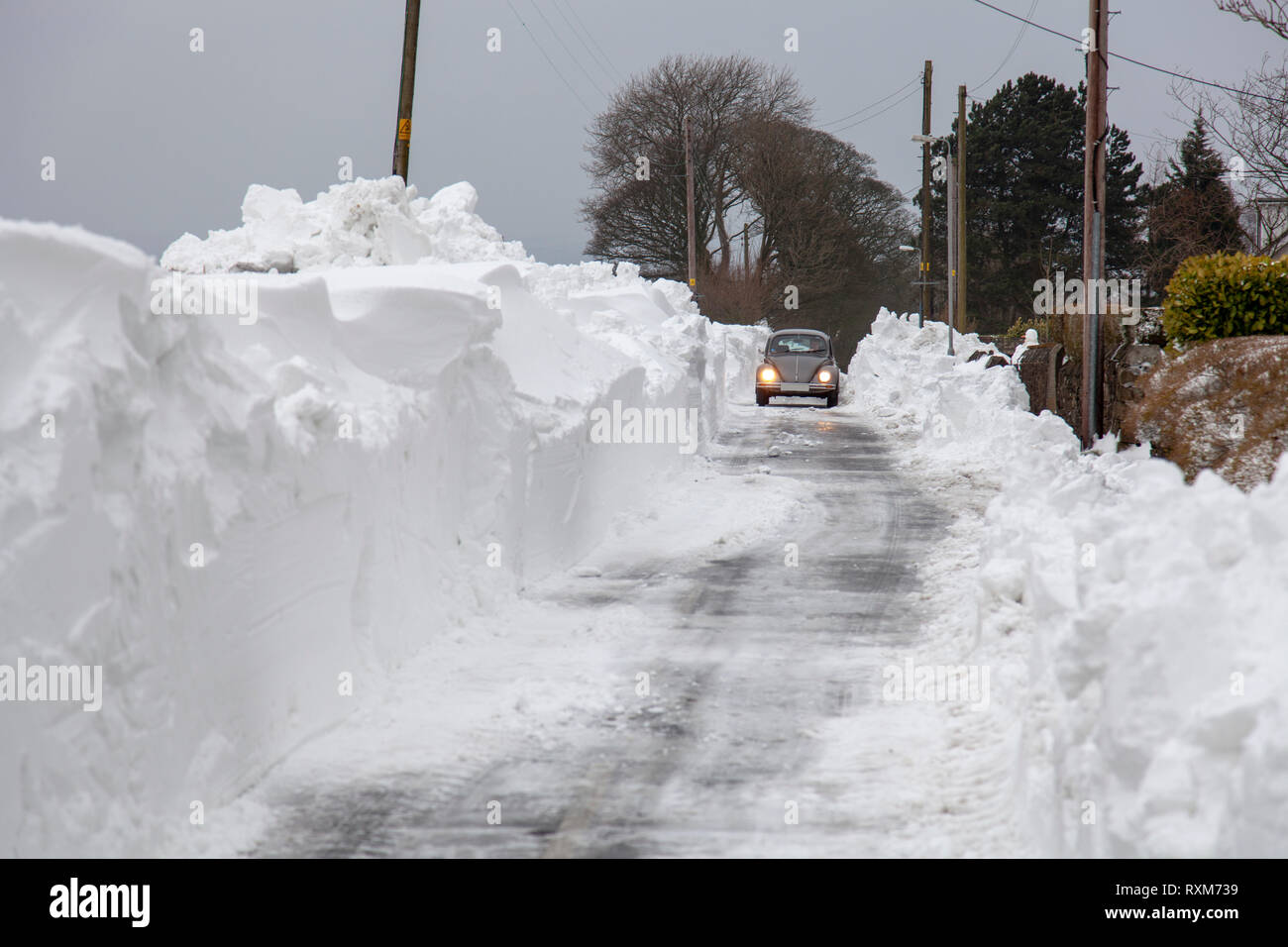 Blizzards and heavy snow fall block a country lane near Chorley Lancashire Stock Photo