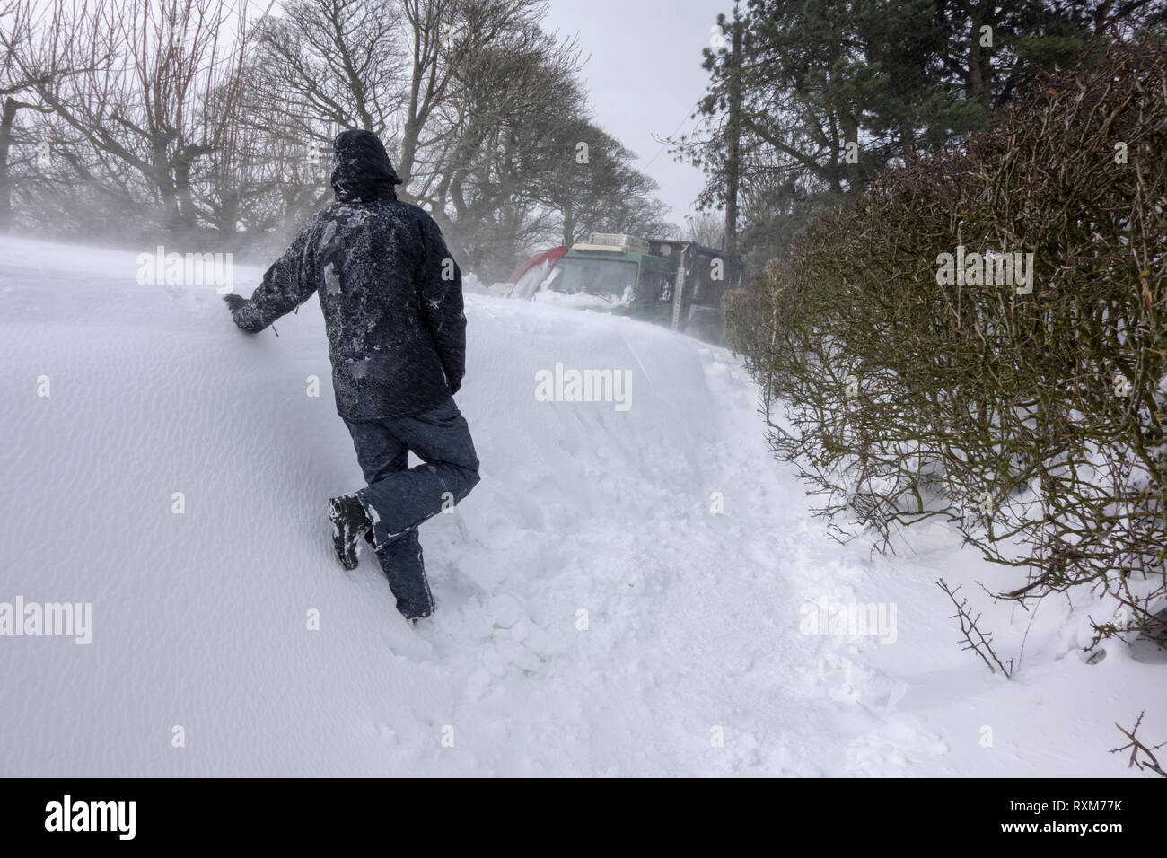 Blizzards and heavy snow fall block a country lane near Chorley Lancashire Stock Photo