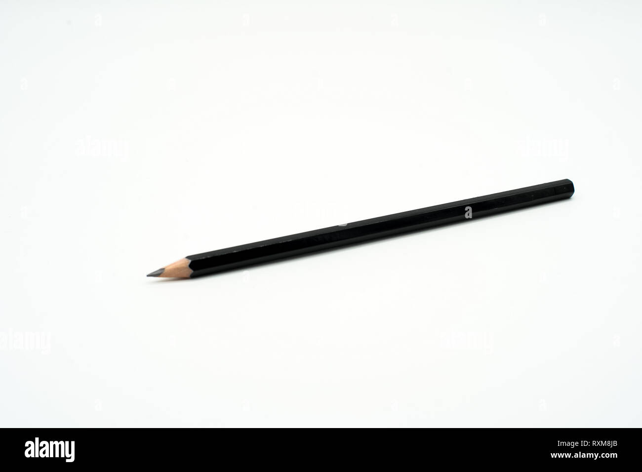 one black wooden pencil isolated on white background Stock Photo - Alamy