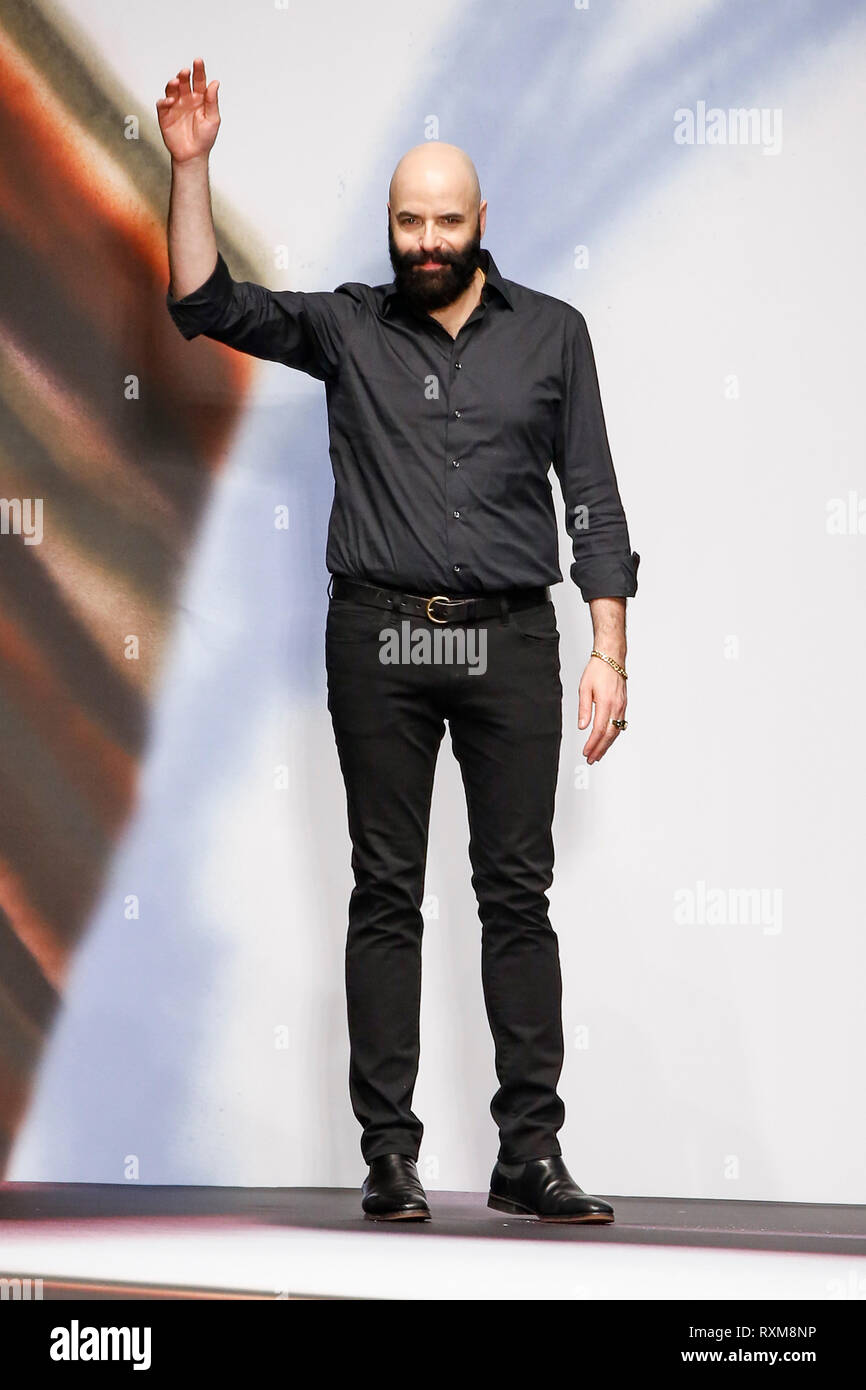 MILAN, ITALY - FEBRUARY 20: Creative Director Avshalom Gur acknowledges the applause of the public after the Maryling show at Milan Fashion Week. Stock Photo