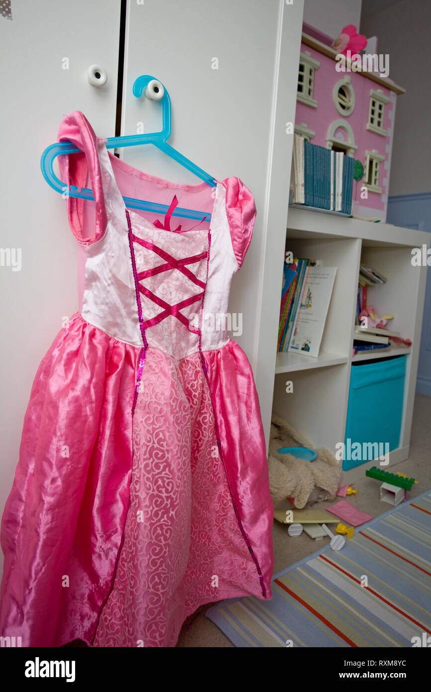 Fairytale dress on hanger in bedroom Stock Photo