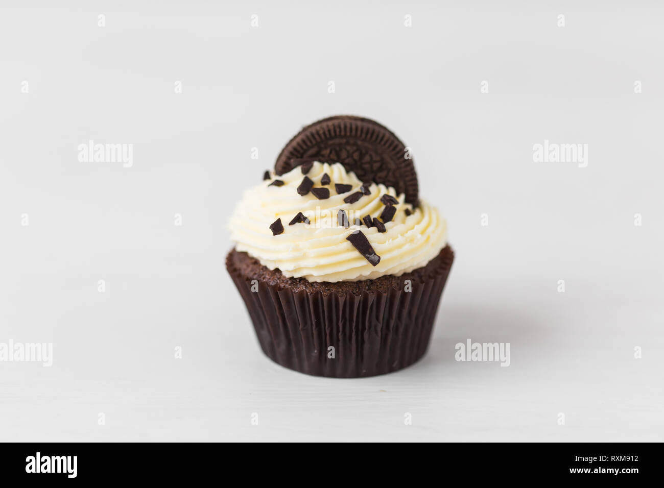 Food and holiday concept - Close up of birthday cupcake over white background Stock Photo