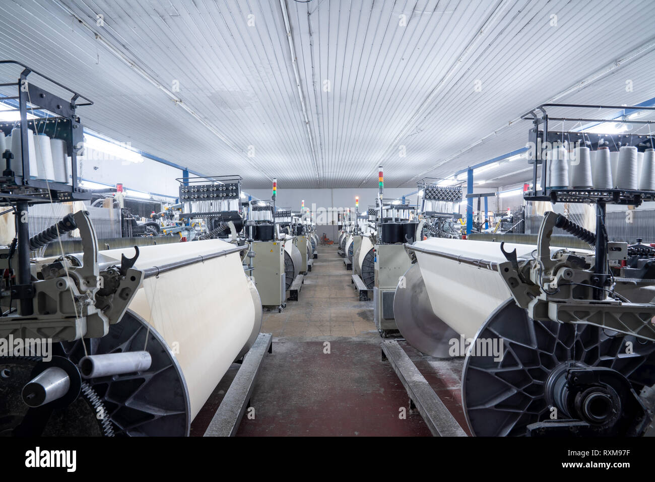 Interior of Textile factory with automated machinery.Concept of Industry and Technology Stock Photo