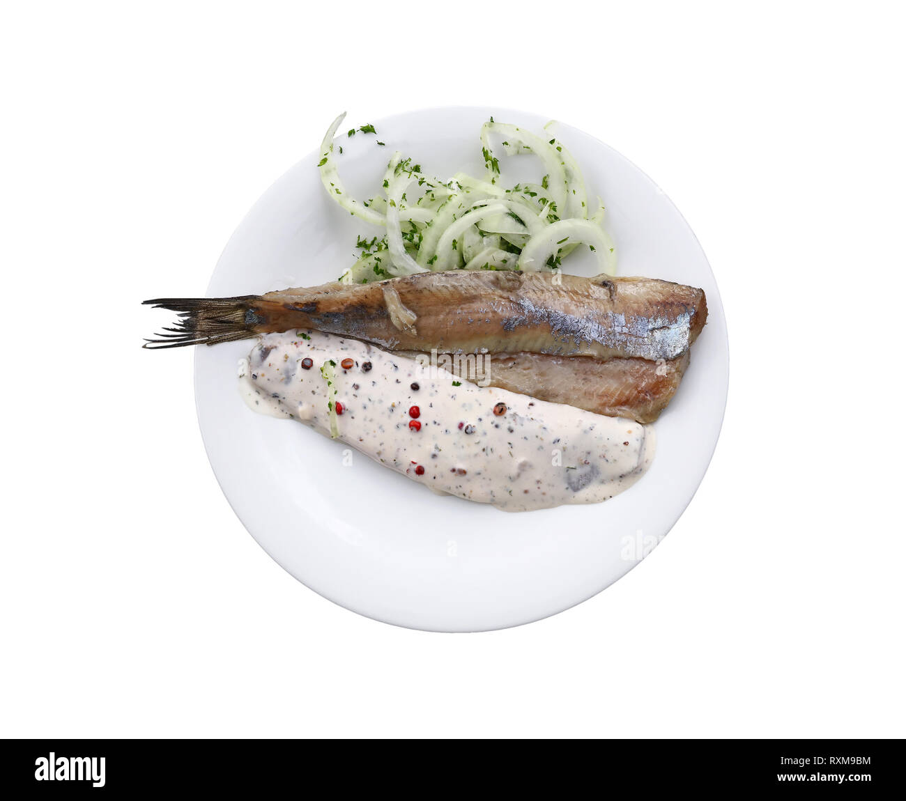 Close up portion of salted pickled herring fish filets with onions and ...