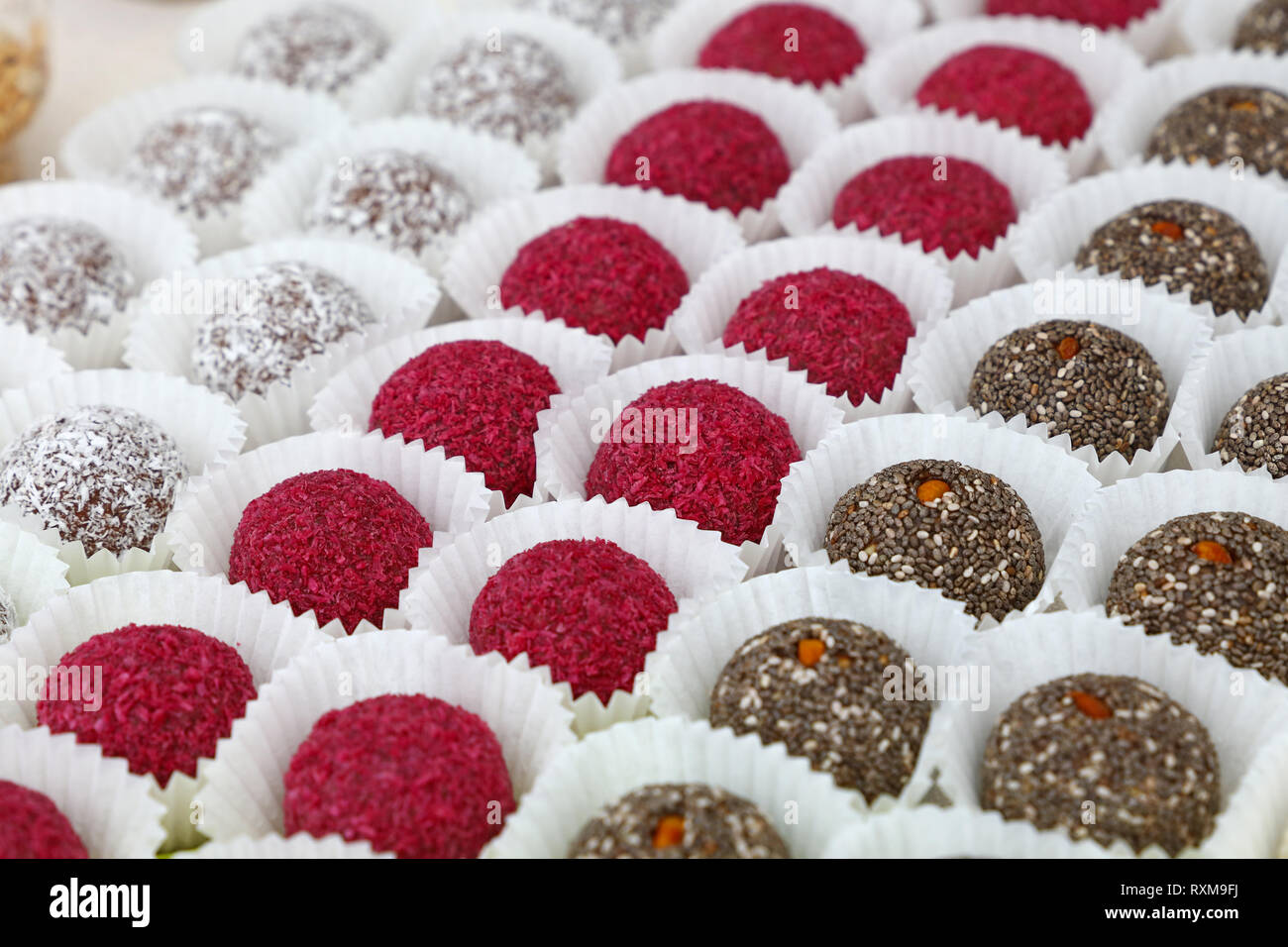 Close up assorted sweet candy cookies in retail display of pastry shop Stock Photo
