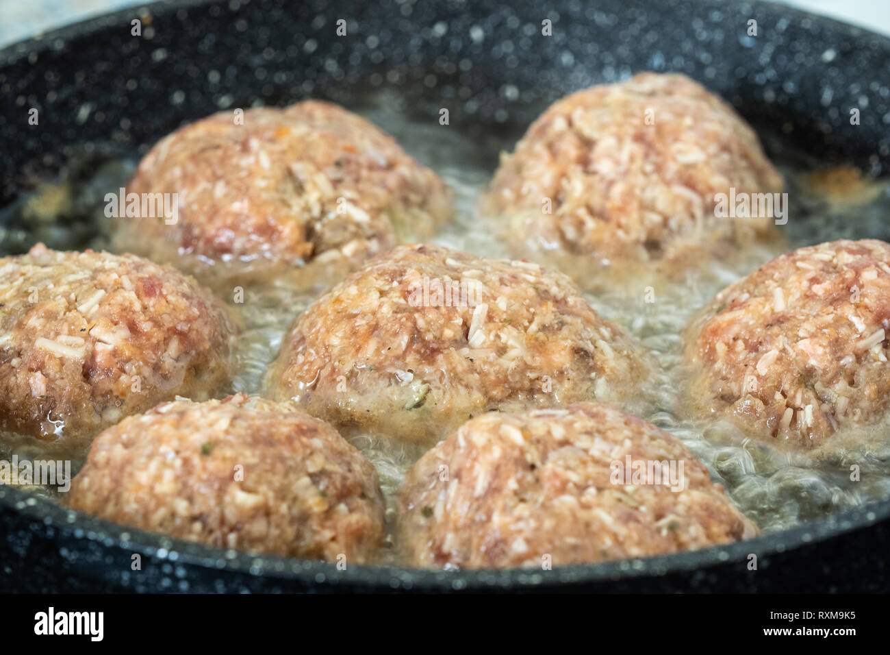 Fried burgers in the pan. Frying food in the oil Stock Photo Alamy