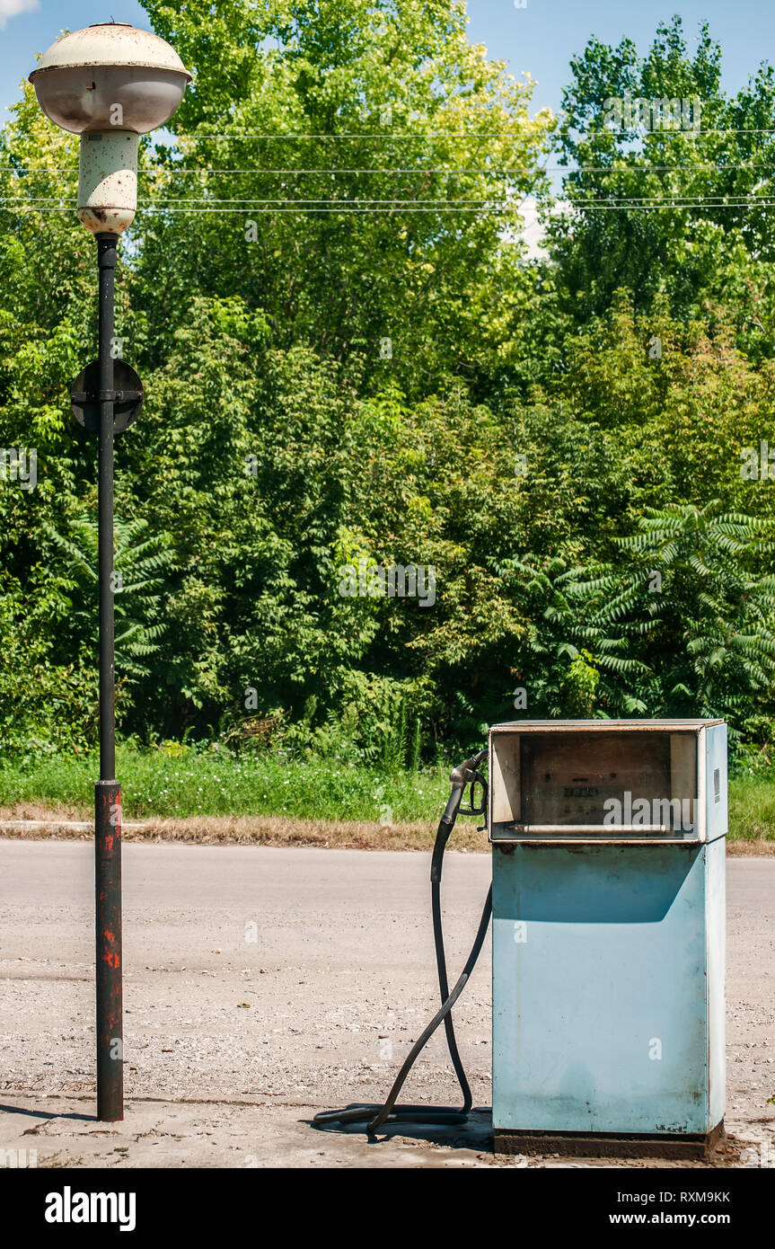 Old abandoned vintage obsolete petrol fuel gas dispenser in former