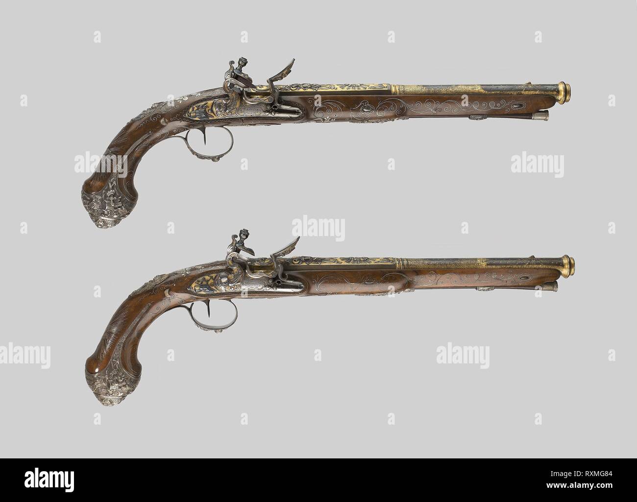 Pair of Presentation Flintlock Pistols in the Eastern Fashion. Gunsmith: Vergnes; (French, active about 1825-45) Marseille. Date: 1801-1825. Dimensions: L. 51.5 cm (20 1/4 in.)  Barrel L. 34.6 cm (13 5/8 in.)  Wt. 2 lb. 14 oz.  Caliber .64. Steel, silver, gold, walnut, and flint. Origin: Marseille. Museum: The Chicago Art Institute. Stock Photo