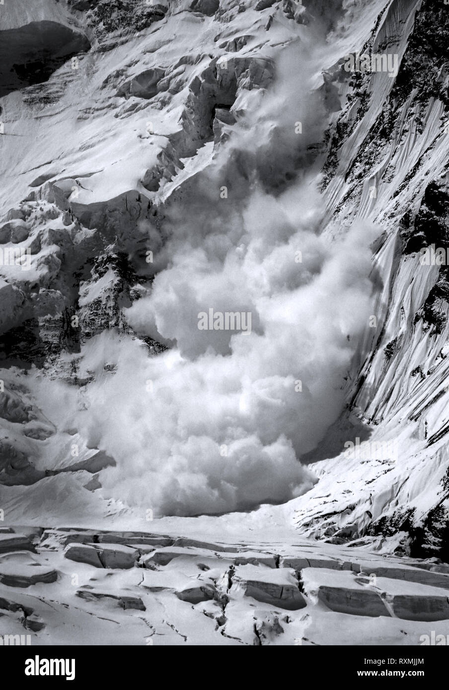 Danger concept: avalanche in the mountains Stock Photo - Alamy