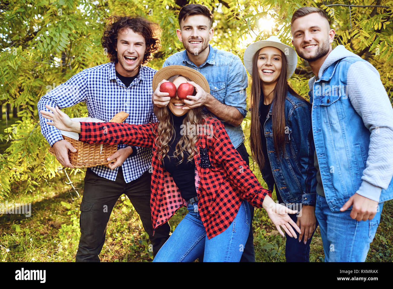 Cheerful friends are laughing in the park. Stock Photo
