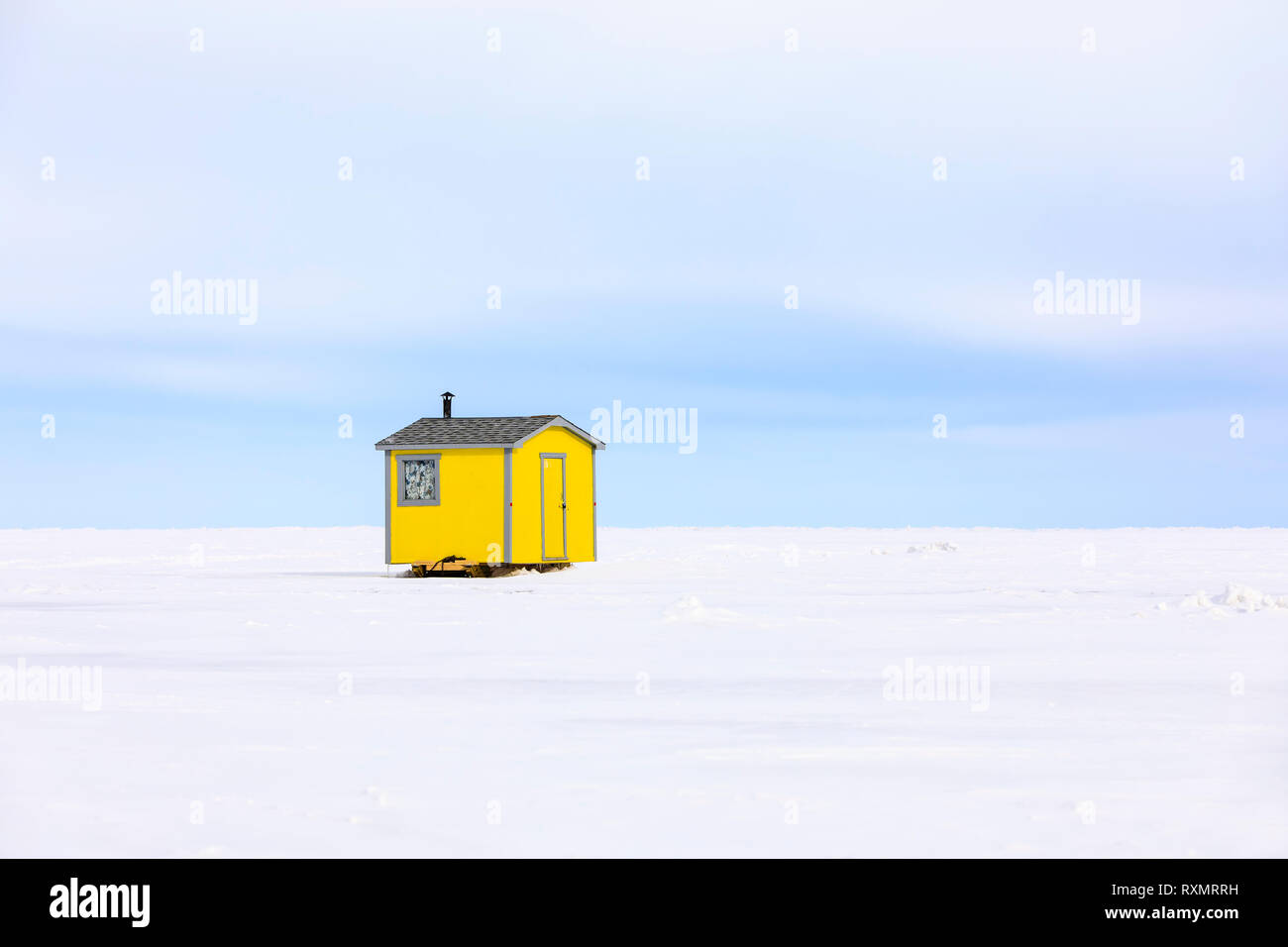 Yellow ice fishing hut on Lake Winnipeg, near Gimli, Manitoba, Canada. Stock Photo