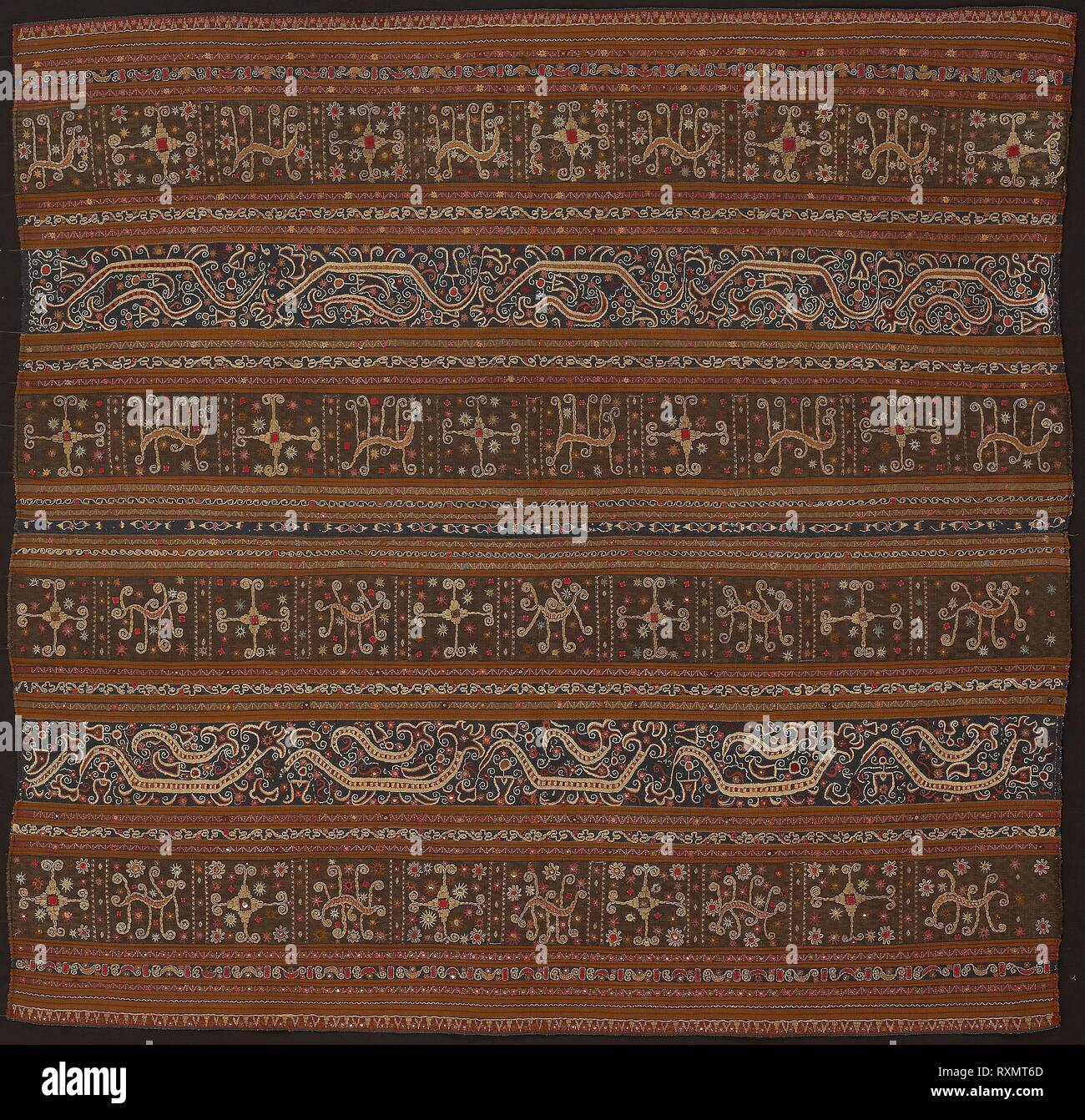 Ceremonial Skirt (tapis). Abung people; Indonesia, South Sumatra, northern Lampung area, Monggala. Date: 1801-1825. Dimensions: 110.5 x 113.7 cm (43 1/2 x 44 3/4 in.). Two panels joined: cotton and silk, stripes of warp-faced, weft ribbed plain weave; warp-faced, weft ribbed plain weave with supplementary brocading wefts, and warp resist dyed (warp ikat) plain weave with supplementary brocading wefts; appliquéd with wool, plain weave; embroidered with silk, cotton, pineapple fiber, silver-leaf-over-lacquered-paper strip wrapped cotton and silver-leaf-over-lacquered-paper strip wrapped bast fib Stock Photo