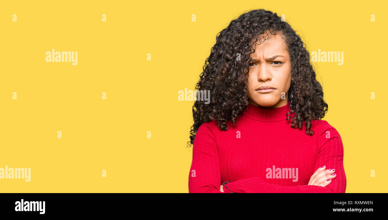 Young Beautiful Woman With Curly Hair Skeptic And Nervous