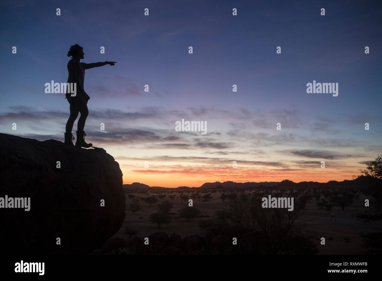 A lady enjoying the view at sunset. Stock Photo