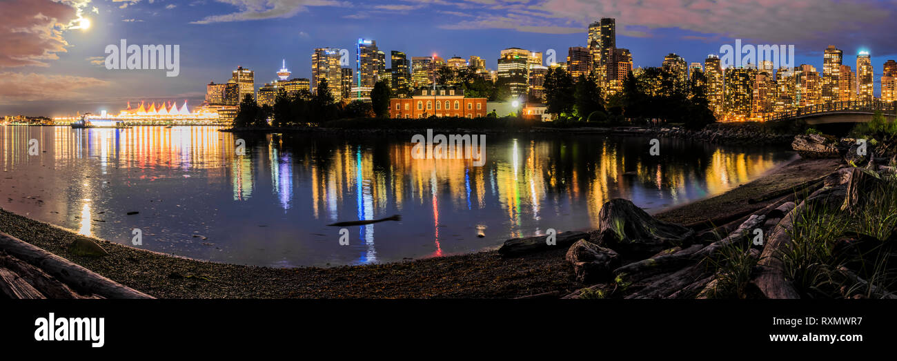 The full moon over the Vancouver Skyline, Coal Harbour, Vancouver, British Columbia, Canada Stock Photo