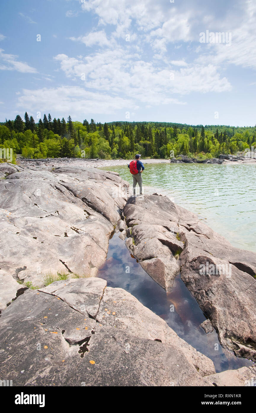 hiker along shoreline, Neys Provincial Park, Lake Superior, Ontario