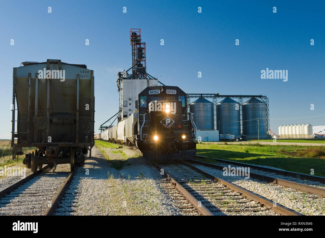 locomotive with rail hopper cars at an inland grain terminal, near Winnipeg, Manitoba, Canada Stock Photo