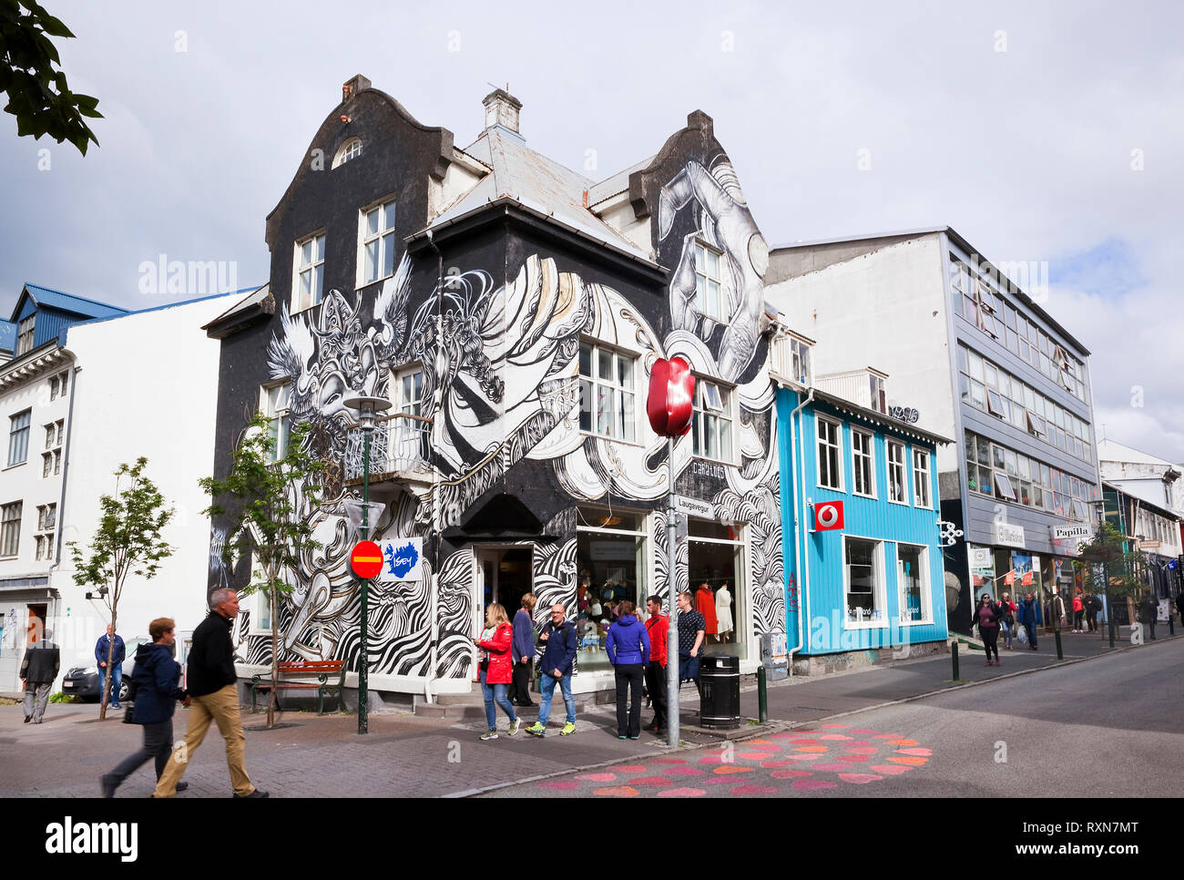 Mural by street artist Caratoes who drew her inspiration from a song by Ylja as part of the Wall Poetry - Urban Nation project in collaboration with Iceland Air Waves in 2015. The building is located at Laugavegur 23, Reykjavik, Iceland Stock Photo