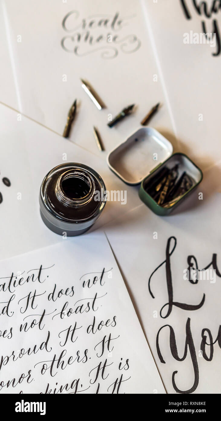 Paper, ink, calligraphy pens and inscriptions. Lettering