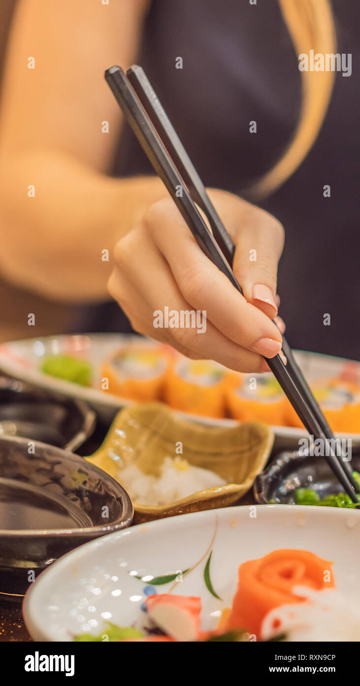 Woman Eating Japanese Food In A Japanese Food Restaurant