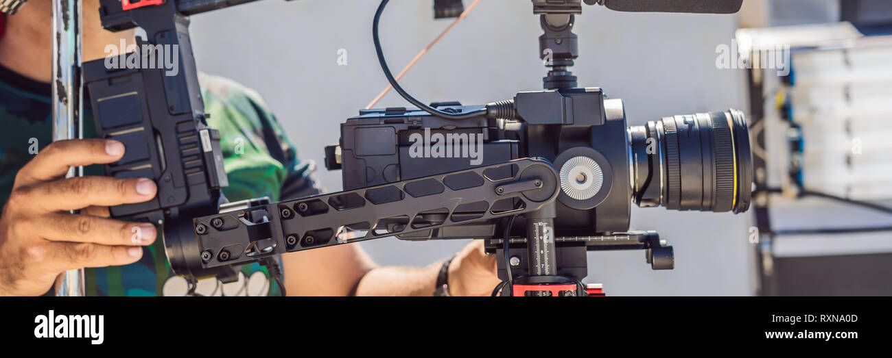 Stabilizer Operator Steadicam operator prepare camera and 3-axis stabilizer-gimbal for a ...
