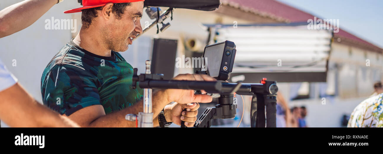 Stabilizer Operator Steadicam operator prepare camera and 3-axis stabilizer-gimbal for a ...
