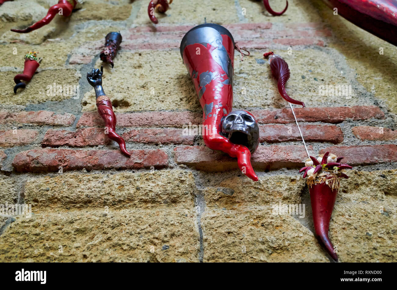 Naples Campania Italy. Luck horns hanged of a wall inside Nennella tavern diner restaurant at Quartieri Spagnoli (spanish quarters) Stock Photo