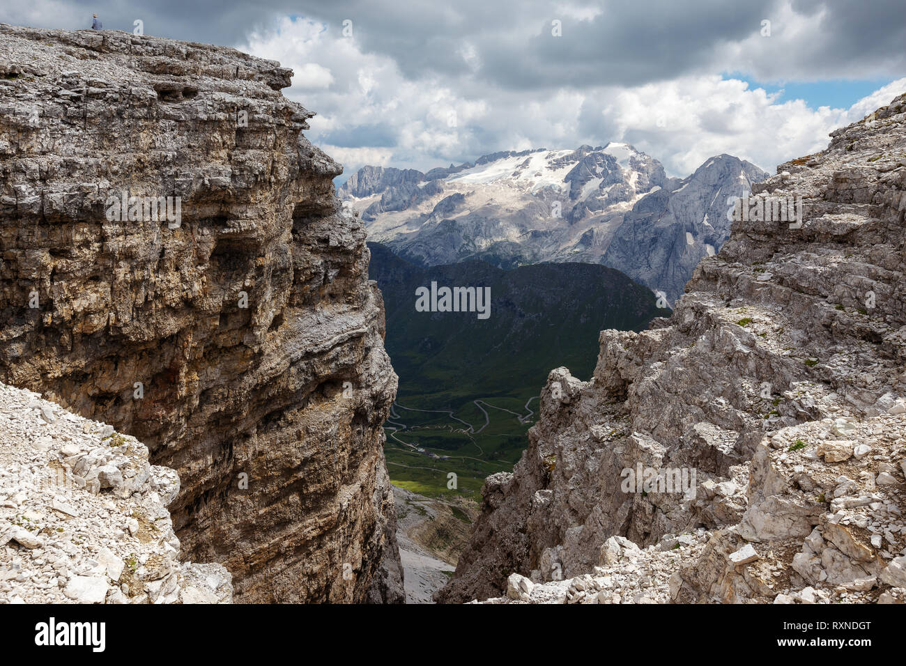 Sedimentary rocks of the Sella Group. In background the Marmolada massif. The Dolomites. Italian Alps. Europe. Stock Photo