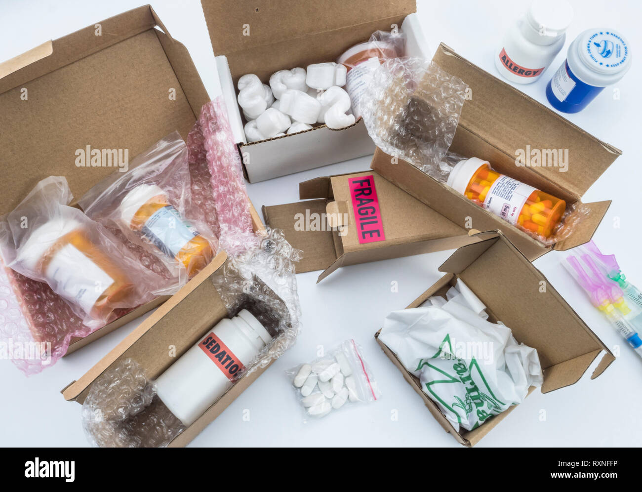 unpacking medication in boxes, Diverse medicines in boxes for humanitarian aid, conceptual image Stock Photo